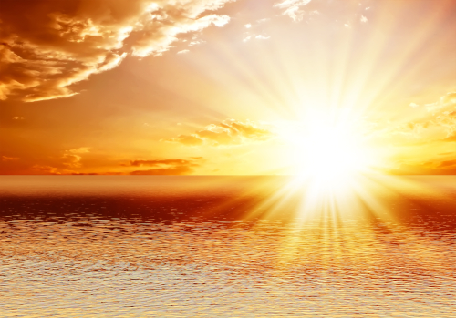 Rays of the rising Sun dispel the clouds