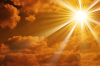golden sun rays with clouds